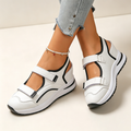 Women's cut-out wedge-platform sneakers with adjustable strap closure