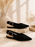 Black pointed-toe slingback flats