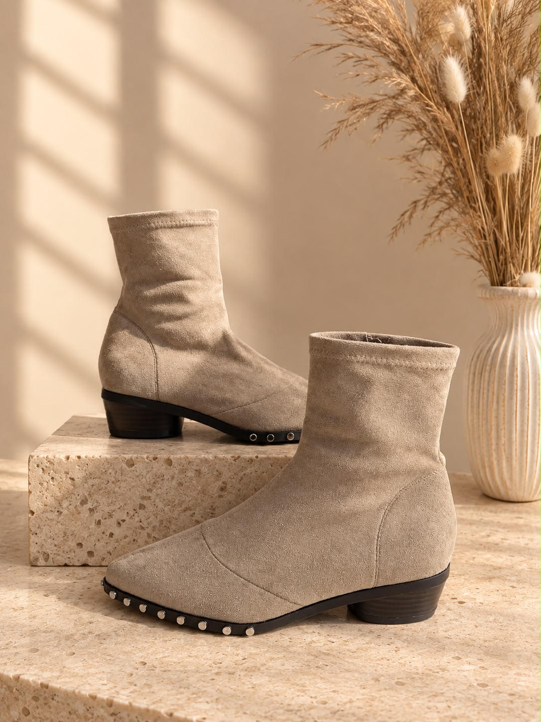 Beige stretch sock ankle boots with studded sole